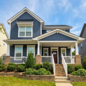 A blue home painted by Superior Colors Painting Services