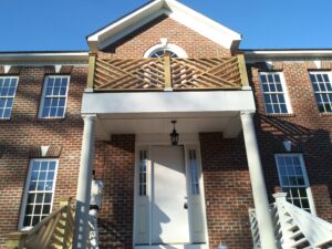 Exterior of home with columns, doors, and windows painted by Superior Colors