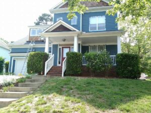 A blue and white house freshly painted by Superior Colors Painting