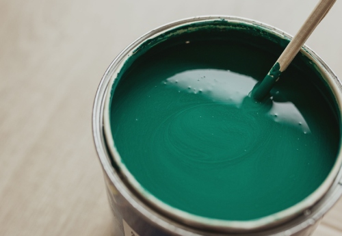 green paint in a bucket ready to use
